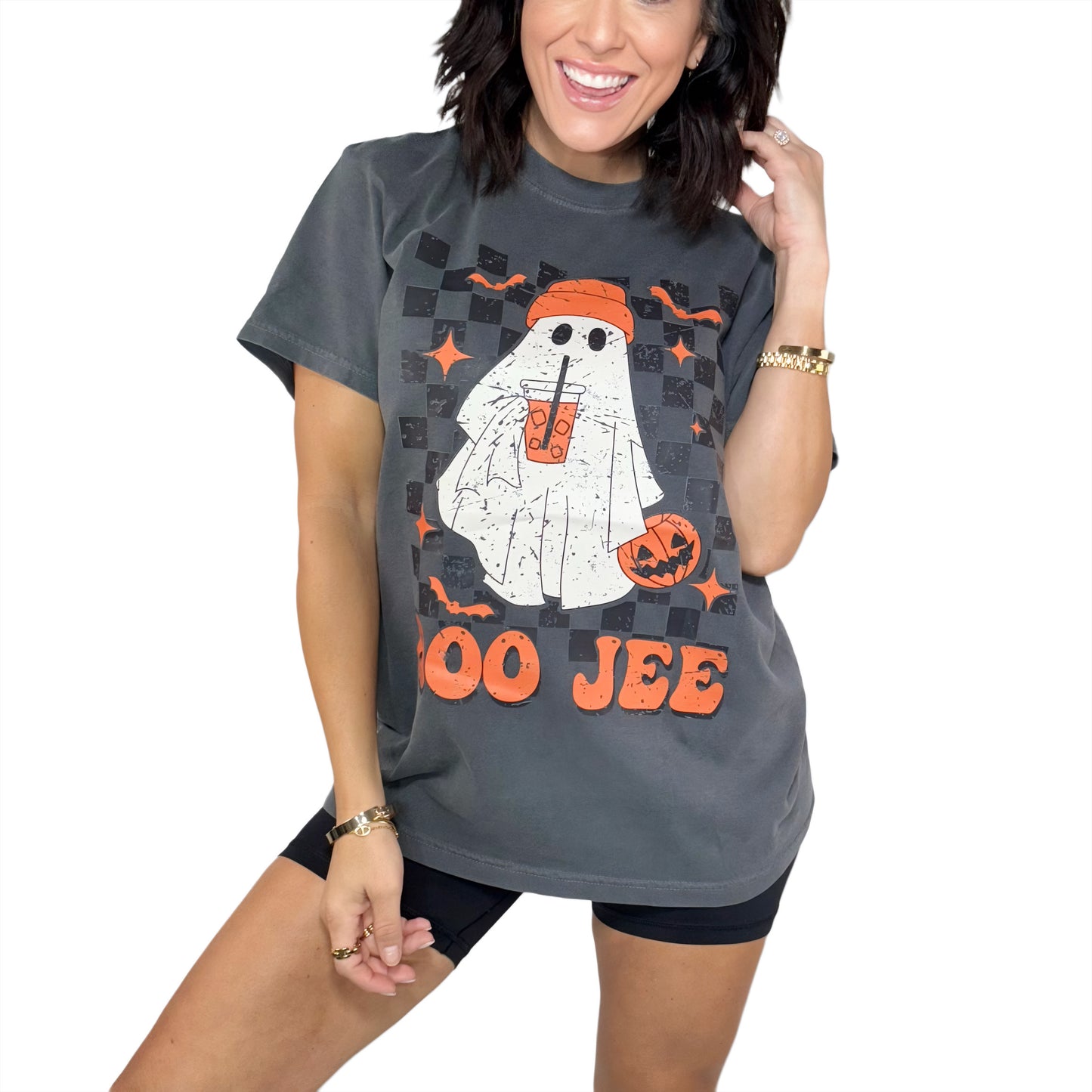 Woman wearing a Halloween-themed t-shirt with a ghost design and 'Boo Jee' text.