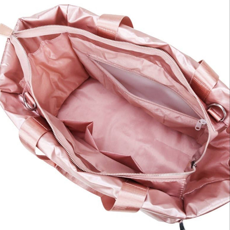 Pink bag with open zipper on a white background