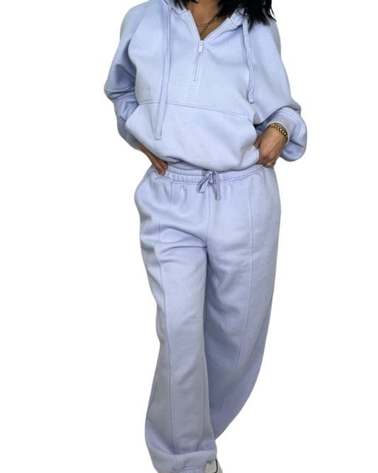Woman wearing a light blue cotton set on a white background