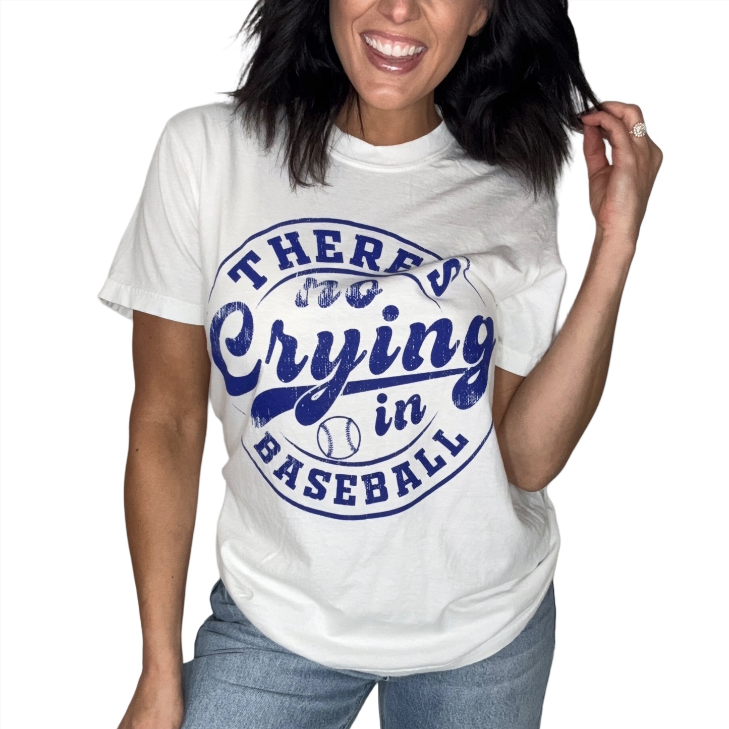 Woman wearing a white t-shirt with blue text 'There's no crying in baseball' on a white background