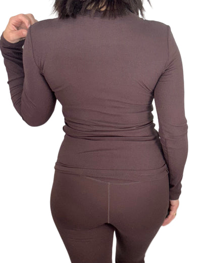 Brown long-sleeve top and pants set on a white background