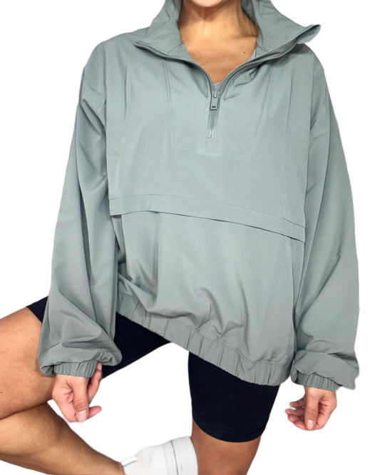 Light gray jacket worn by a person on a white background