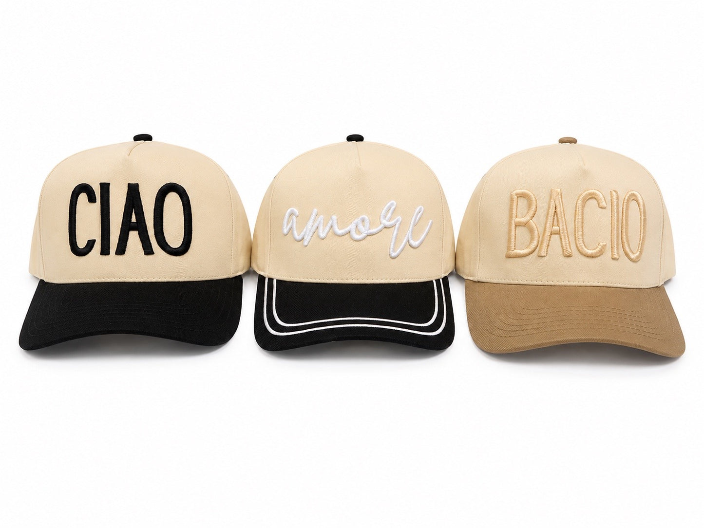 Three tan hats with the words Ciao, Amore and Bacio across the front of them 