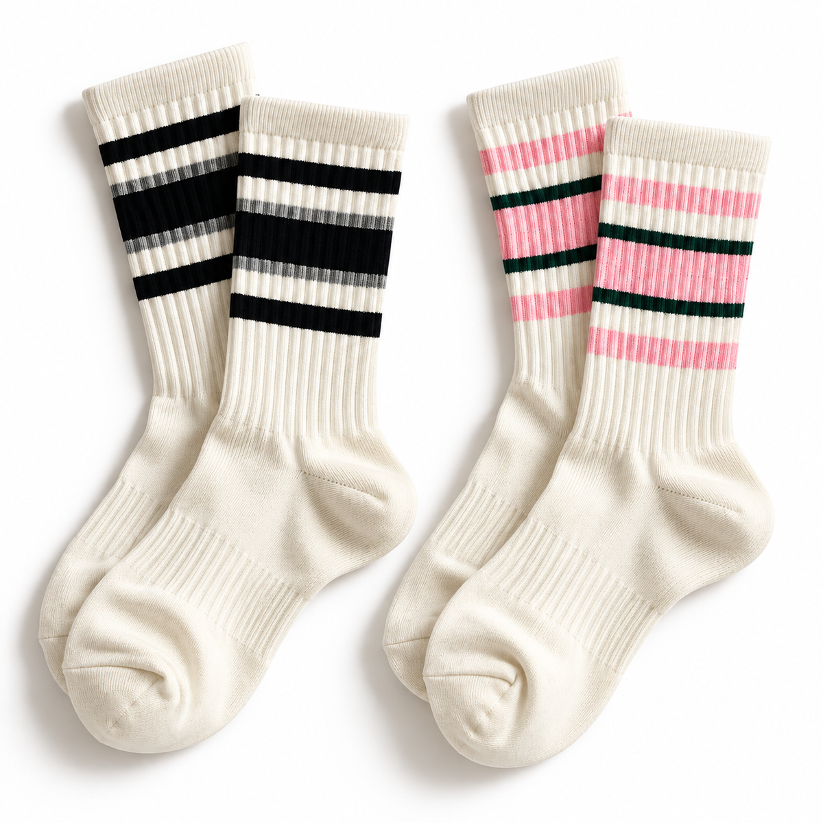 Two pairs of off-white ribbed crew socks with three black horizontal stripes near the cuff and the other with pink horizontal stripes near the cuff on a white background 