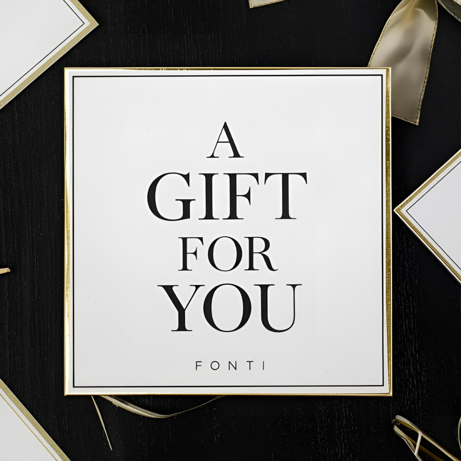Gift card with 'A Gift For You' text on a black background with decorative elements.